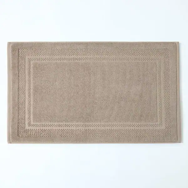 Badematte Baumwolle beige mit geripptem Rand, hochwertig und weich für das Badezimmer.