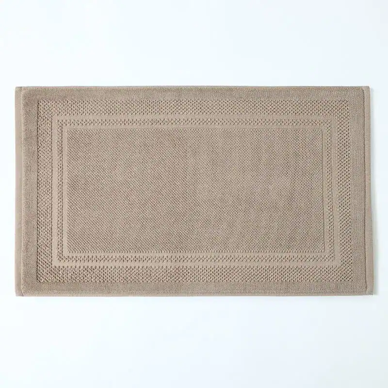 Badematte Baumwolle beige mit geripptem Rand, hochwertig und weich für das Badezimmer.