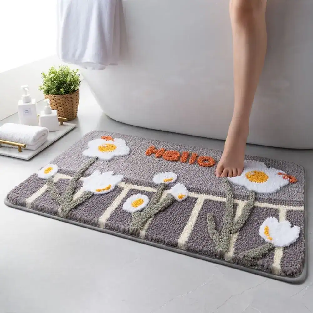 Badematte mit Blumenmuster und Hello-Aufdruck, weich und rutschfest für Badezimmer.
