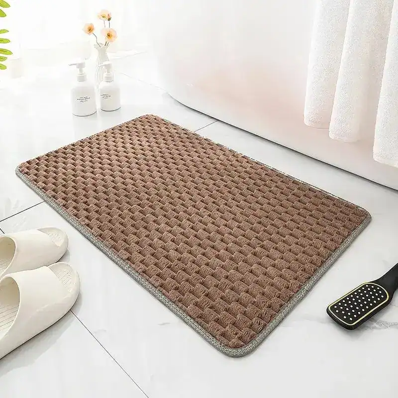 Badematte Bordeaux mit strukturiertem Muster und grauem Rand für Komfort und Stil im Badezimmer.