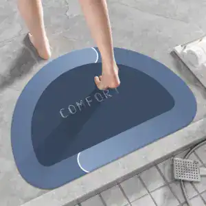 Blau Komfort Badematte mit 'COMFORT'-Aufdruck, runder Design für Badezimmer.