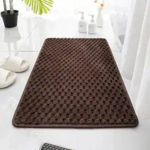 Braune Badematte mit rutschfestem, texturiertem Oberflächenmuster für Badezimmer.