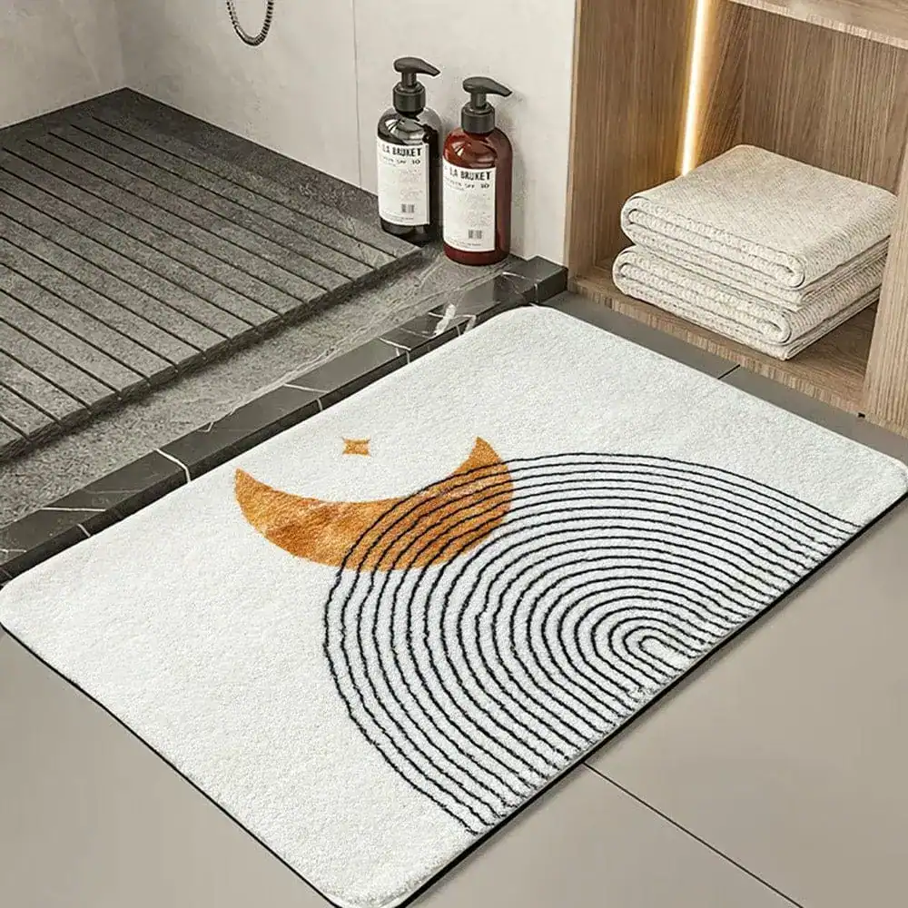 Design-Badezimmermatte mit Mondmotiv und Spirale, modernes Bad-Accessoire.