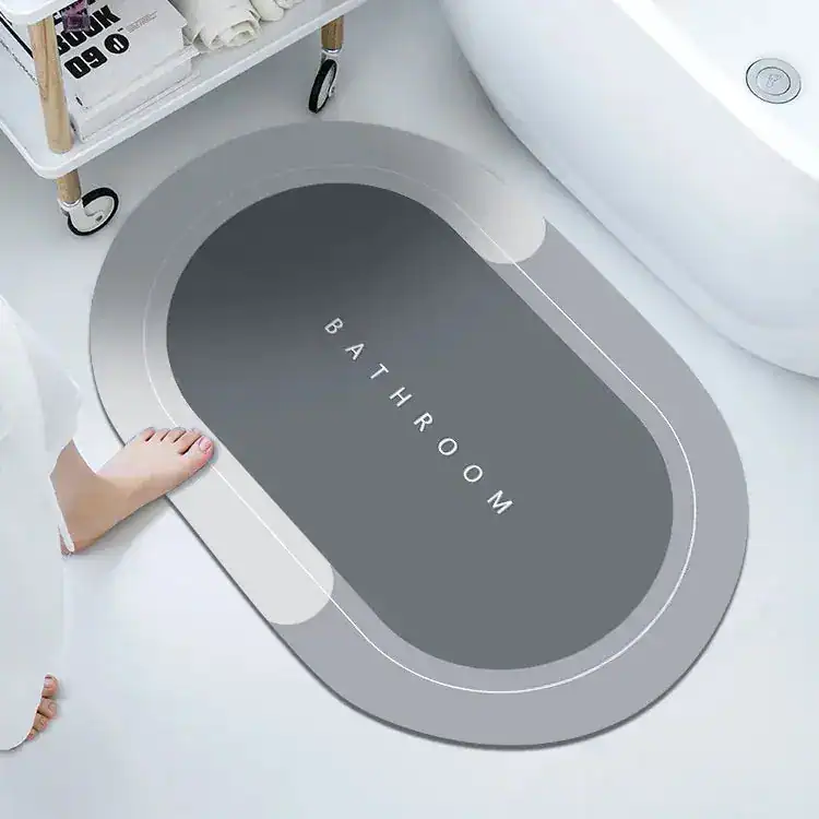 Ovale Badezimmermatte mit 'BATHROOM'-Aufschrift, modernes Design für Bad.