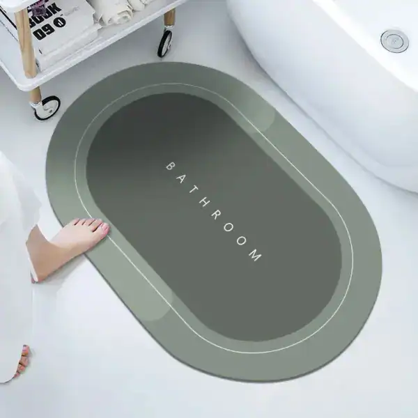 Ovale Badezimmermatte mit 'BATHROOM'-Aufdruck, modernes Design für Bad.