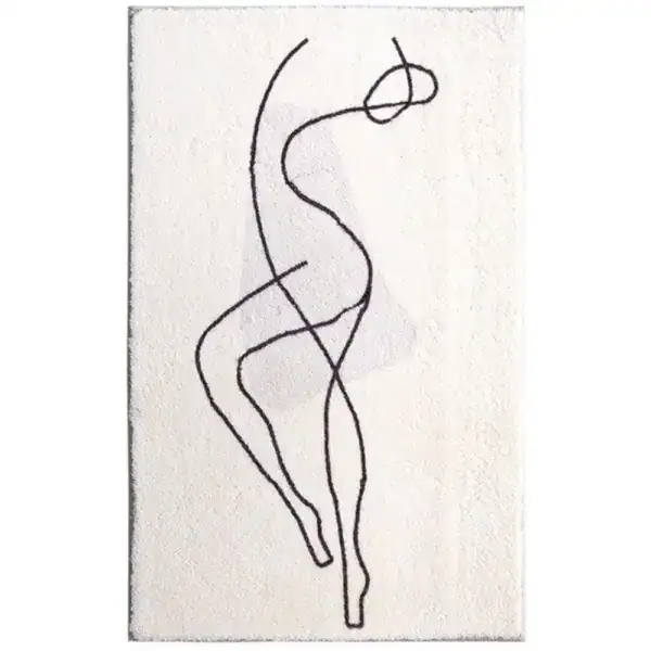 Grafisch gestalteter Badezimmerteppich mit schwarzem Linienmotiv auf cremefarbenem Untergrund.