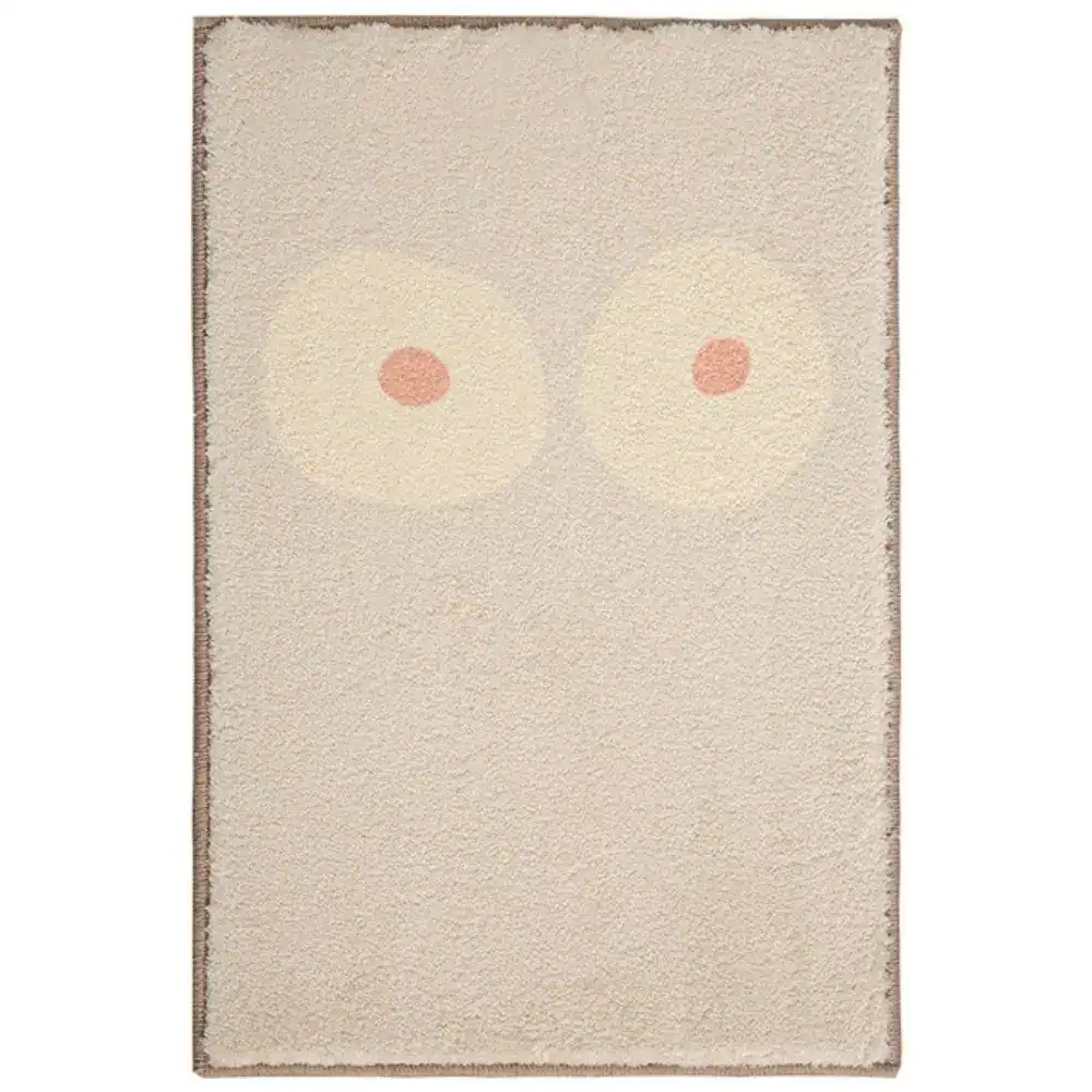 Grafisch gestalteter Badezimmerteppich mit stilisierten Augenmotiv in sanften Farben.