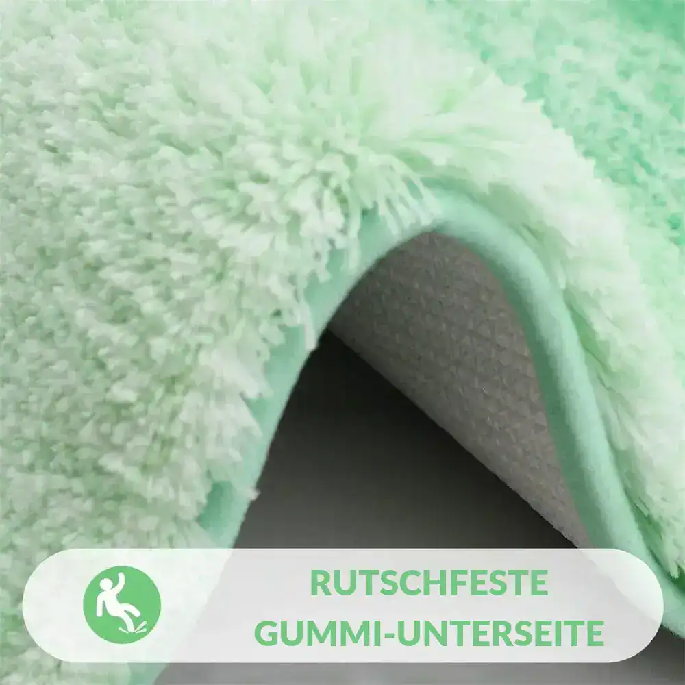Hellgrüner Badezimmerteppich mit gummiertem, rutschfesten Untergrund und flauschigem Oberflächenfaser.
