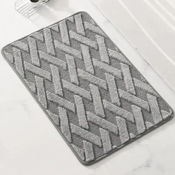 Grauer Badezimmerteppich mit geometrischem Muster, Komfort Badematte für Dusch- und Badbereich.
