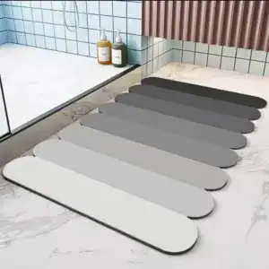 Badezimmerteppich Steine in verschiedenen Grautönen für moderne Badezimmer.
