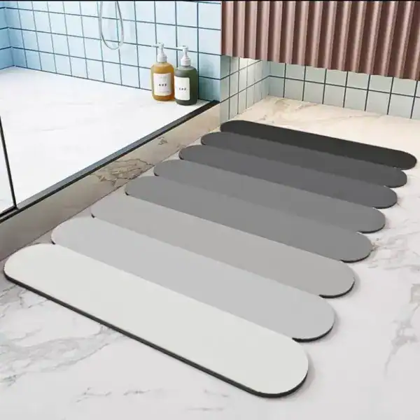 Badezimmerteppich Steine in verschiedenen Grautönen für moderne Badezimmer.