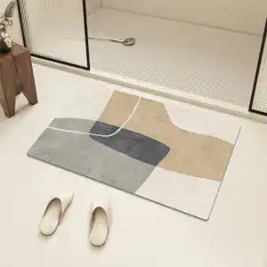 Badezimmerteppich Terra mit modernem geometrischem Muster in Grau und Beige.