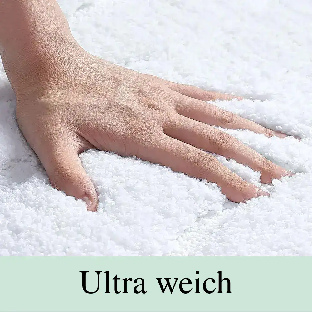 Weißer Badezimmerteppich mit weicher Textur, ideal für Komfort und Trocknung.