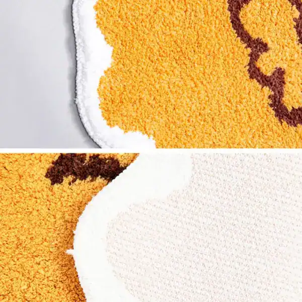 Badteppich Fisch in Gelb mit braunem Muster, weicher Hochflor-Textur und rutschfestem Untergrund.