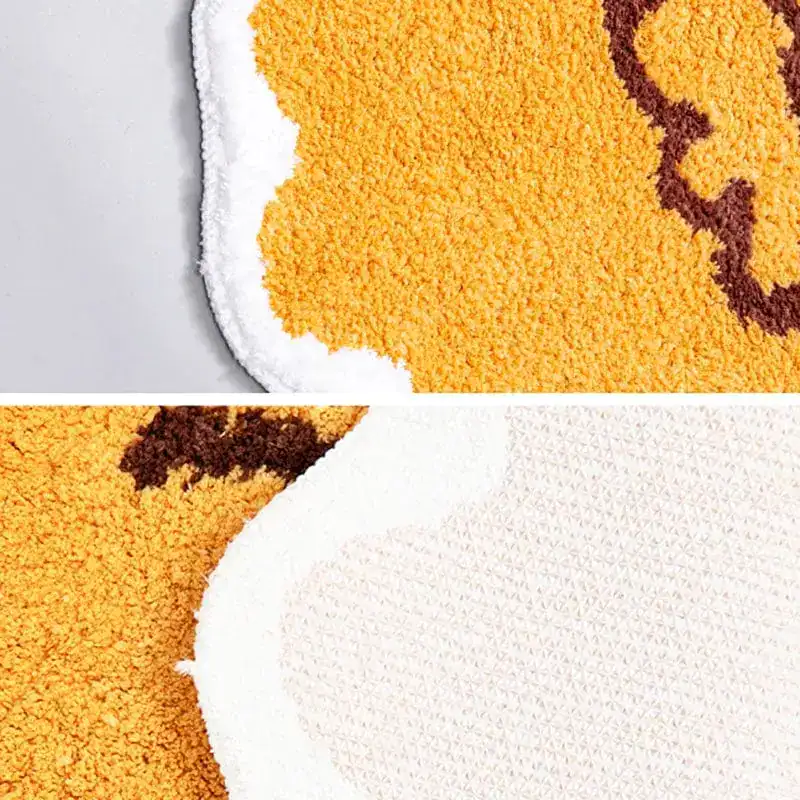Badteppich Fisch in Gelb mit braunem Muster, weicher Hochflor-Textur und rutschfestem Untergrund.