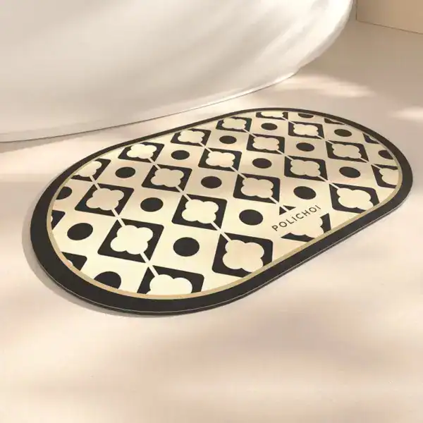 Ovaler Badteppich mit schwarz-weißem Muster, ideal für Badezimmer und Dusche.
