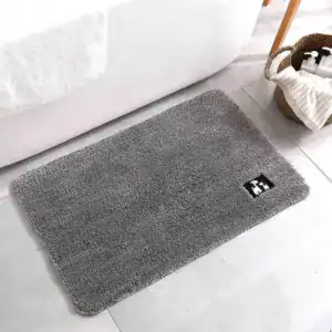 Rutschfeste Badezimmermatte grau mit Logo, ideal für Bad und Dusche.